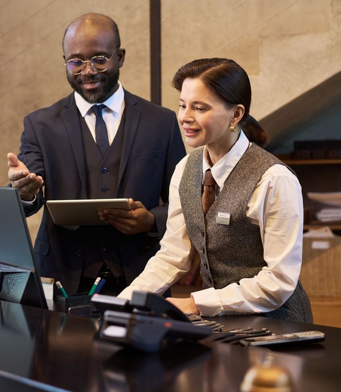Palace Group One team at a hotel reception desk